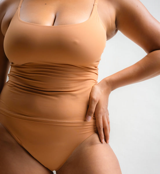 Model wearing Pretty Kitty Klub Briefkini in Kitty Latte brown with matching camisole