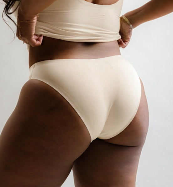 Rear three-quarter view of Pretty Kitty Klub Briefkini in Crème Meow cream
