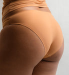 Rear view of Pretty Kitty Klub Briefkini in Kitty Latte brown, showing back coverage.