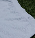 Close-up of blue cotton pointelle knit fabric on the Pretty Kitty Klub Comfy Kitty lounge set.