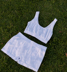 Blue Pretty Kitty Klub Comfy Kitty Set top and matching shorts laid flat on green grass.